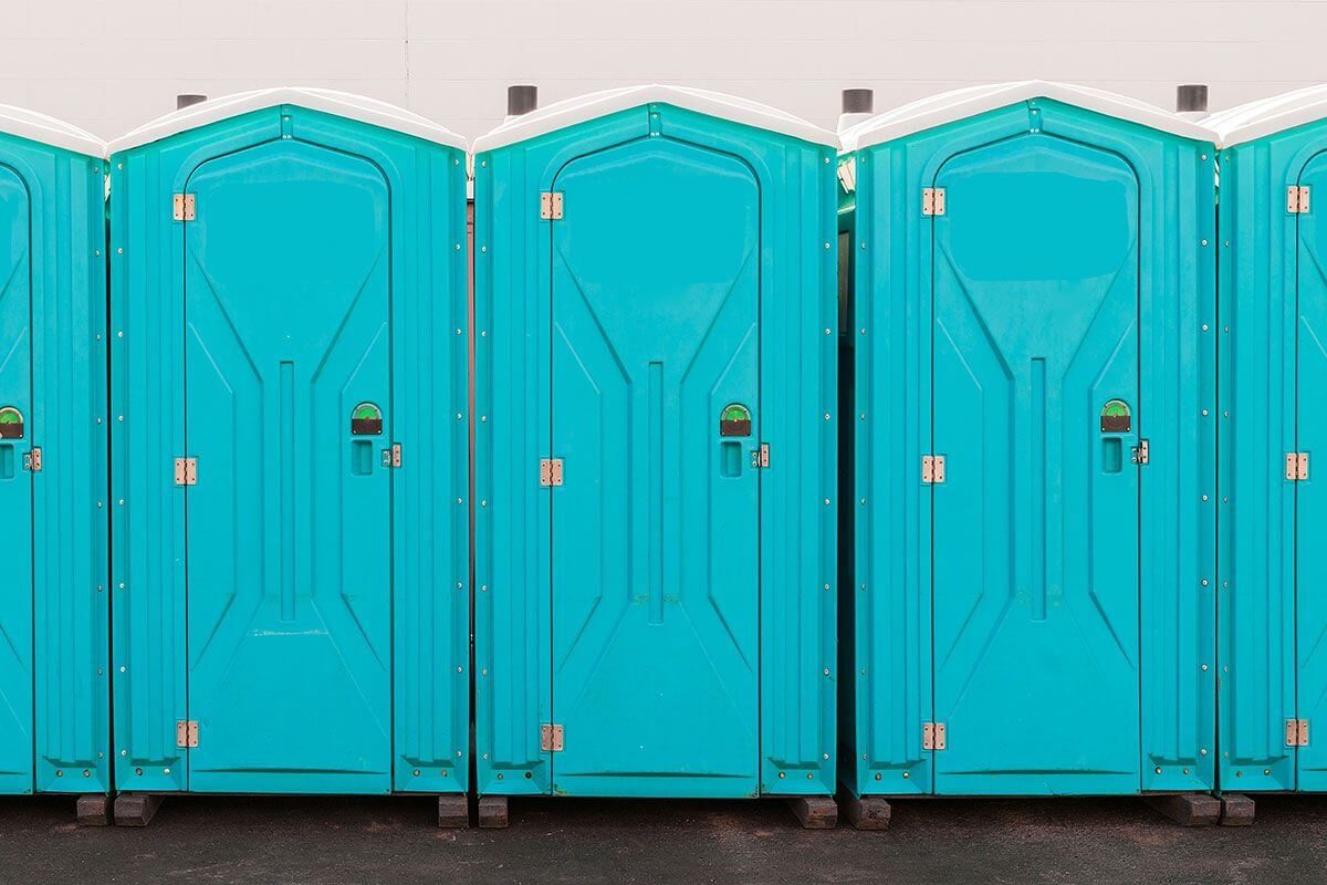 Industrial portable restroom units at a plant in Denver, Colorado